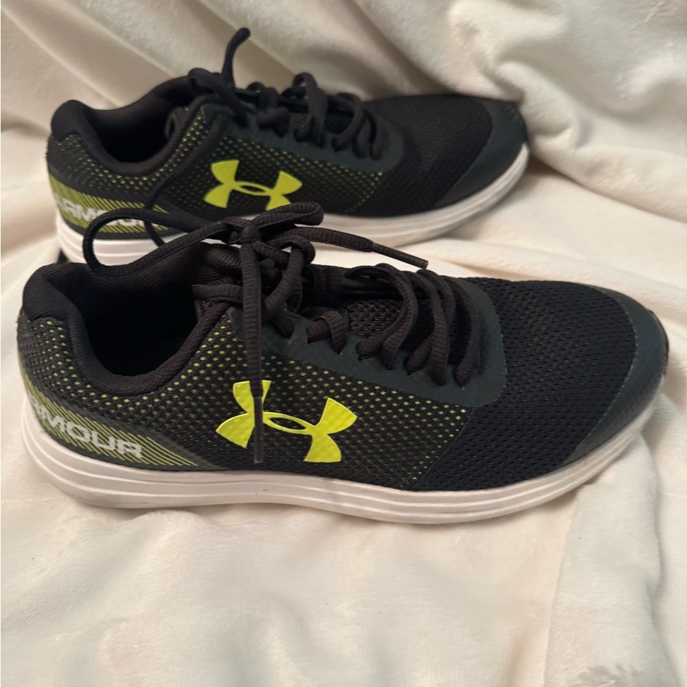 Gently used Under Armour Black and Neon Yellow Boys Size US 5Y